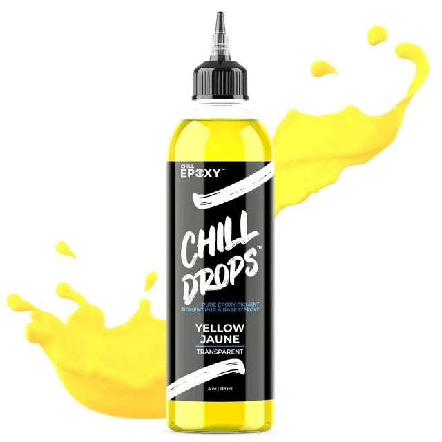 Flaske med gul, flydende epoxy pigment til resin art med sprøjtet dråbeeffekt.